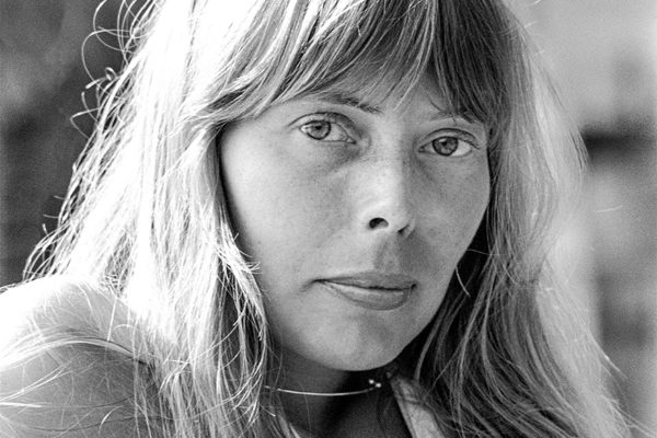 Joni Mitchell, sultry stare, by pool near the home she shared with David Geffen in the Hollywood Hills, June 1972